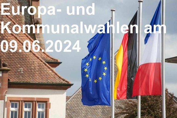 Ansicht  Dach  Altes Rathaus  und Flaggen von Europa, Deutschland und Frankreich - auf dem Foto wei&szlig;e AufschriftEuropa- und Kommunalwahlen am 09.06.2024
